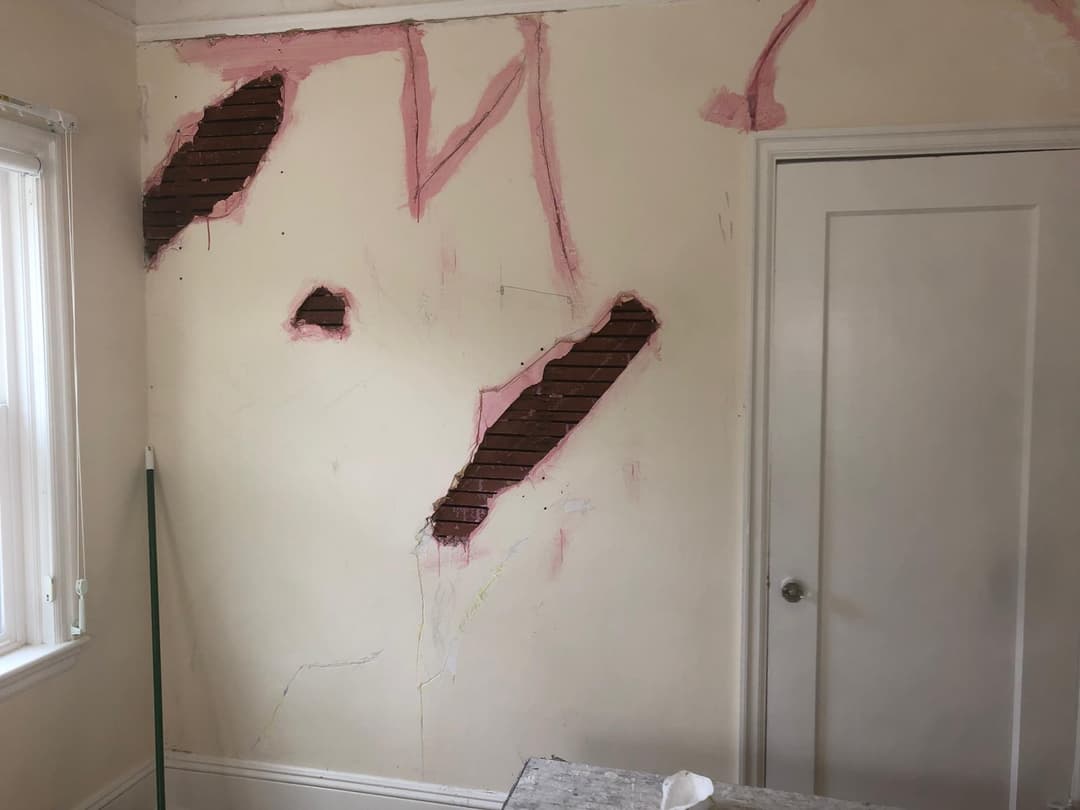 picture of a wall with a big hole ready to be plastered