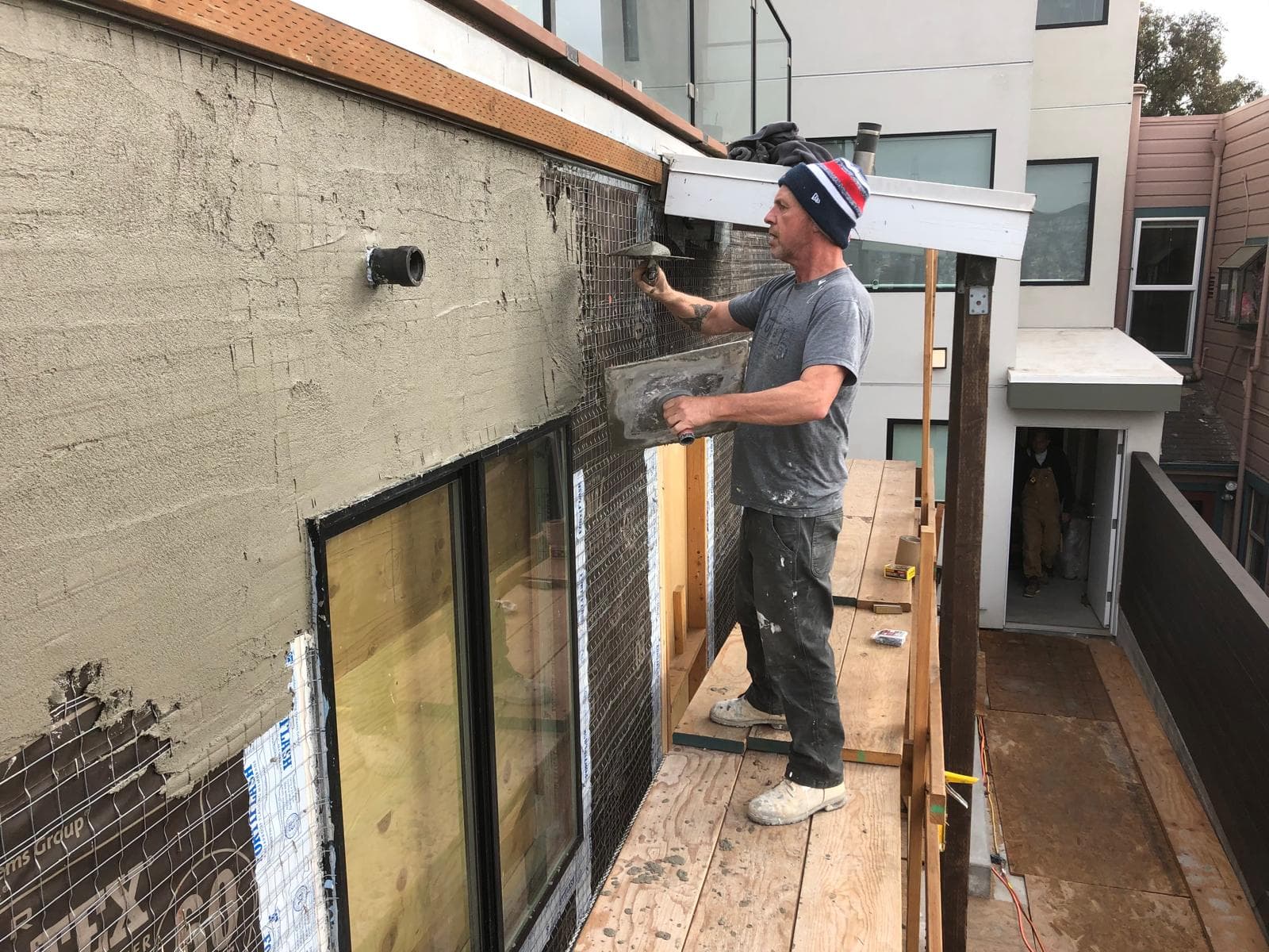 picture of a wall getting plastered